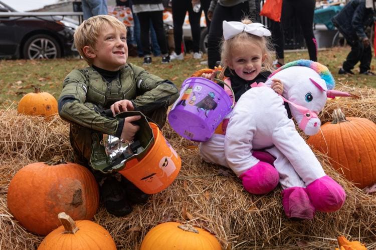 Kids playing with the Halloween pumpkins