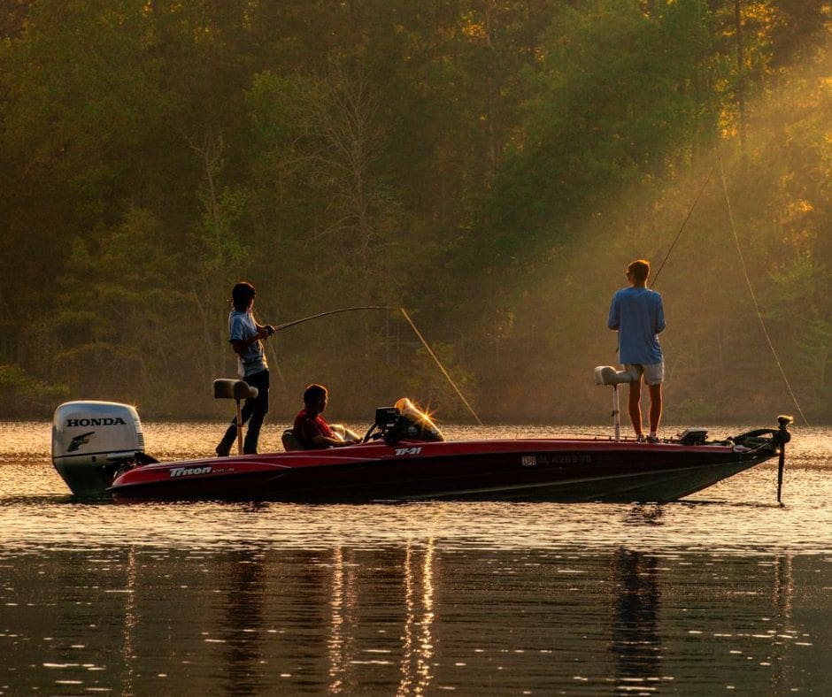 people on the boat are Fishing in the Lake Martin
